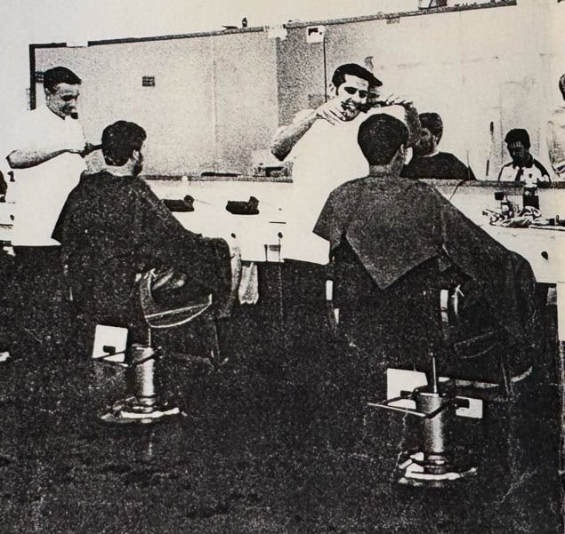 Historical photo of men getting hair cut in Wahroonga barbershop